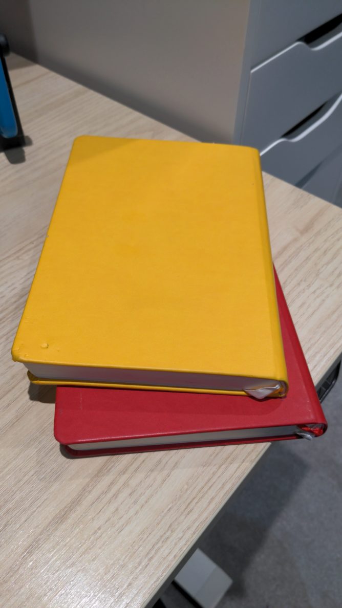 A stack of journals on my desk.